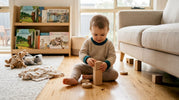 Toddler playing with wooden toys on floor